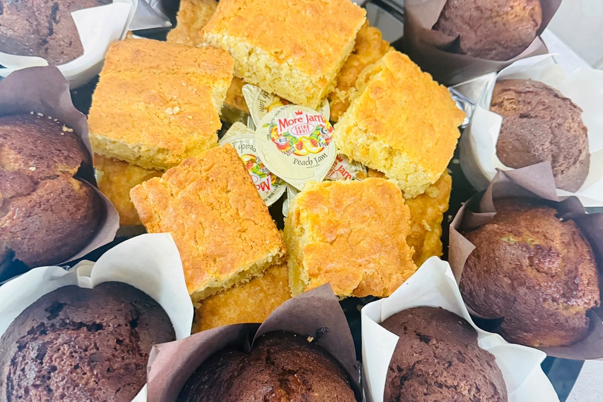 Chocolate muffins and cornbread squares arranged on a platter